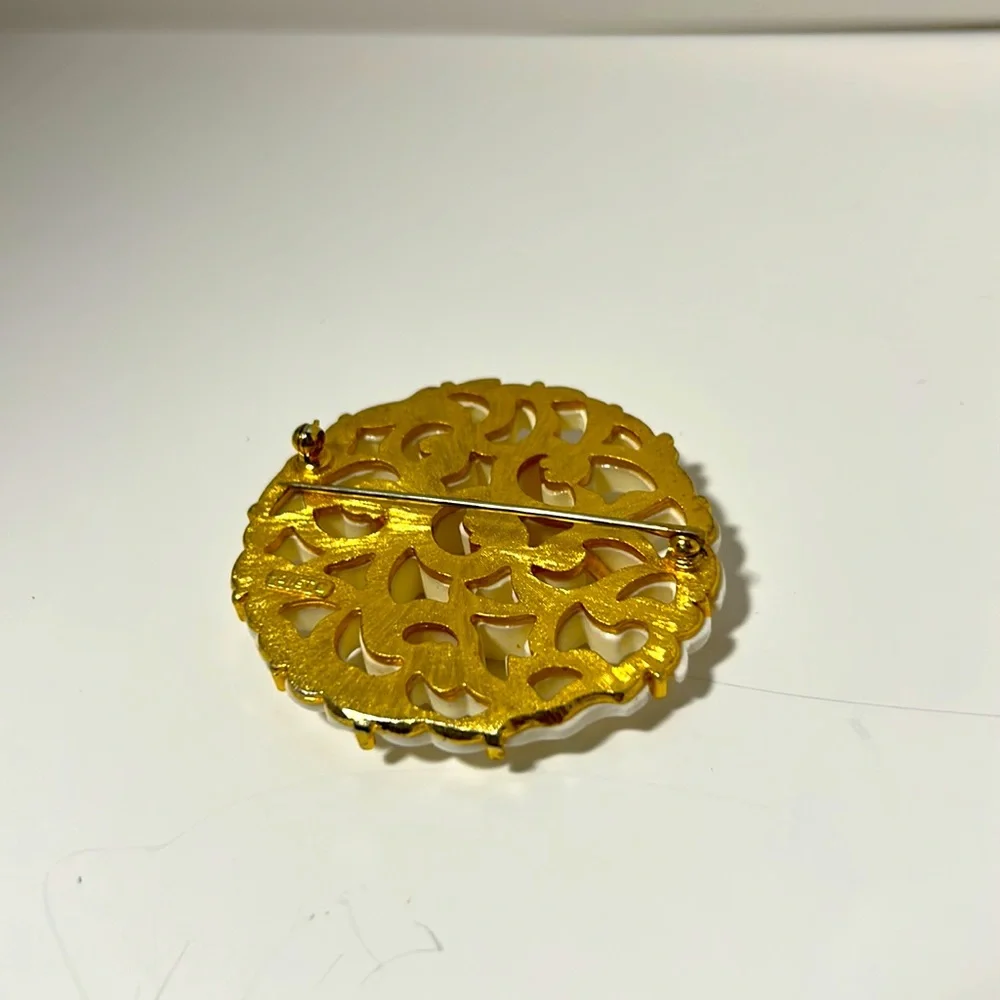 Monet brooch vintage filigree gold tone white cut out design 2 “